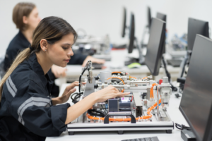 a female engineer or technician working on a robotics project