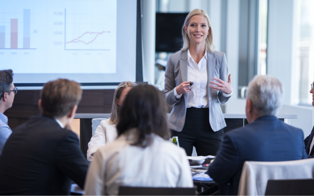 women confidently giving presentation