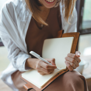 woman writing in journal