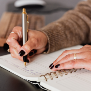 woman writing in planner