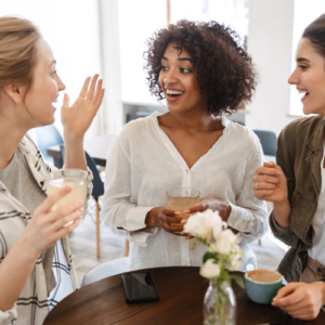 women chatting over coffee