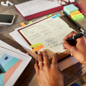 woman writing in planner