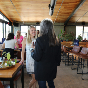 women networking at a Women In Automotive Social local event