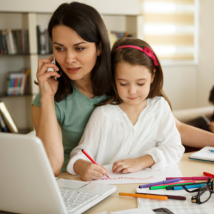 mom working with her child on her lap